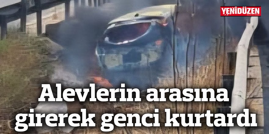 Alevlerin arasına girerek genci kurtardı