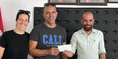 Büyük ikramiye talihlisi çekini aldı