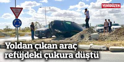 Yoldan çıkan araç refüjdeki çukura düştü