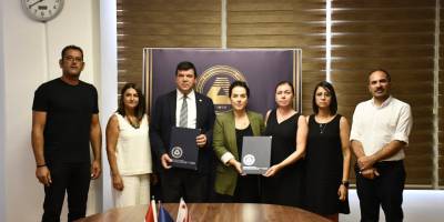 DAÜ ile Şampiyon Melekleri Yaşatma Derneği arasında iş birliği ve burs protokolü imzalandı