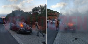 Araç alev aldı, yoldan geçenler söndürdü