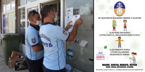 Afişler işletmelerin girişlerine asıldı