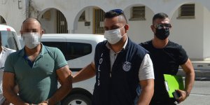 Aracında tabanca ve mermilerle yakalandı